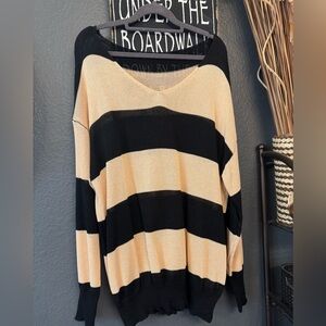 Elegant Black and Tan V-Neck Sweater